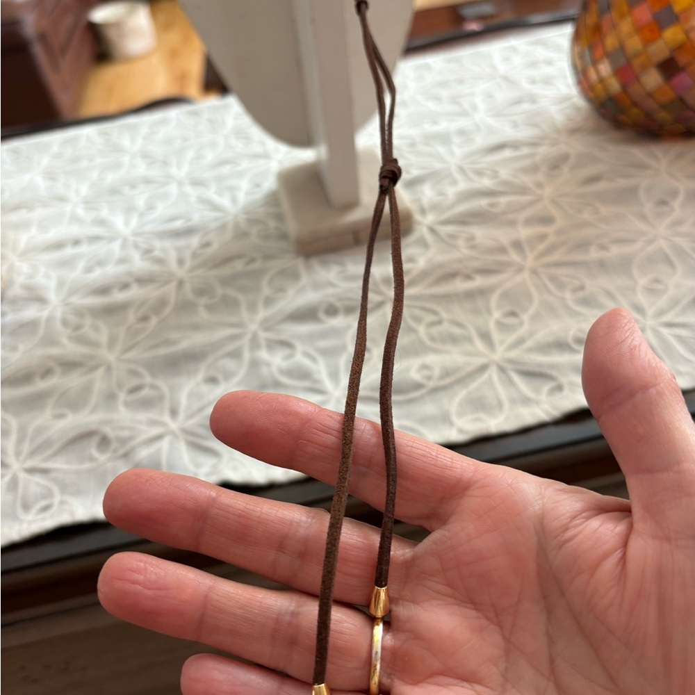 Elegant Gold Sculpture Long Pendant Necklace on Brown Cord - Picture 6 of 9